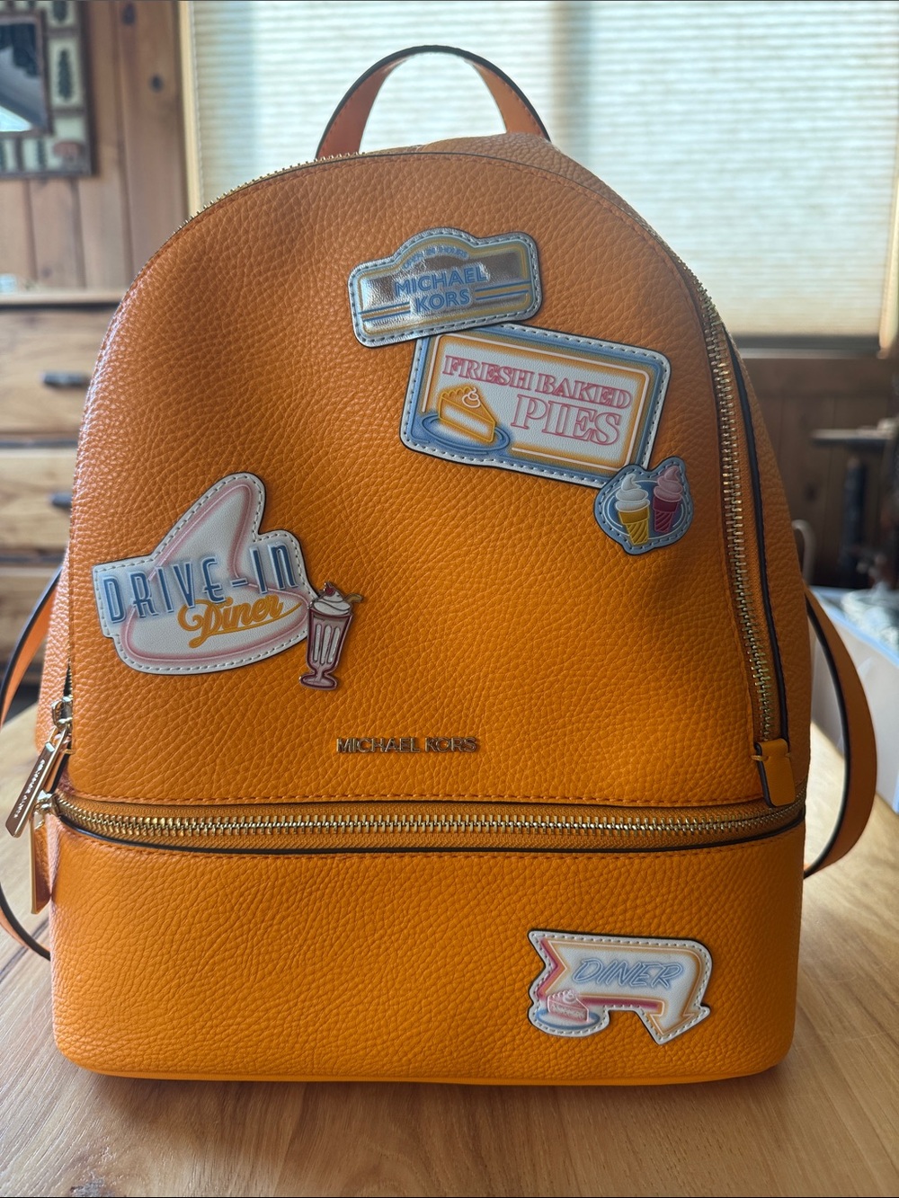 Michael Kors Pop Orange Pebbled Leather Patch Backpack